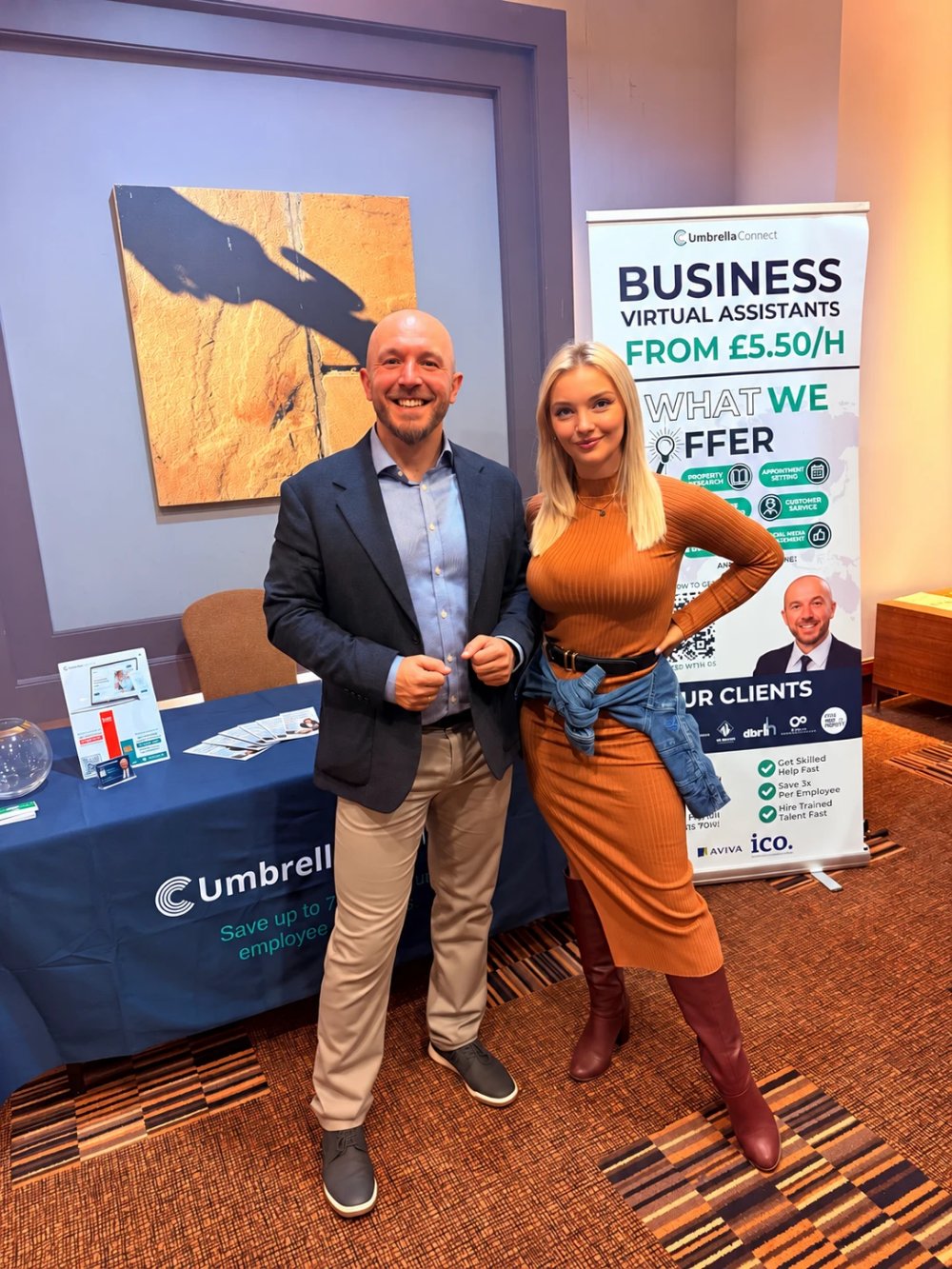 Lukasz Koziarski and Paula Jadeszko at the Umbrella Connect stand at a UK business conference